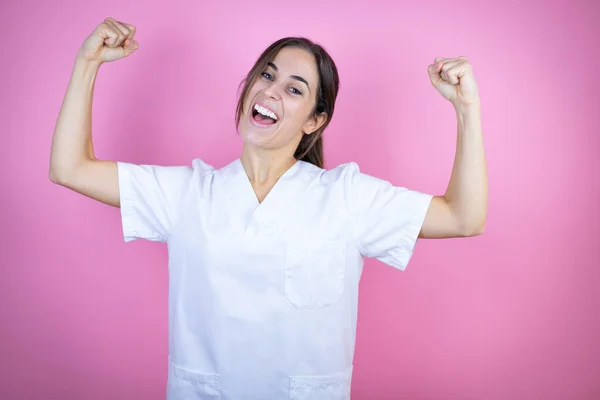 Young Brunette Doctor Girl Wearing Nurse Surgeon Uniform Isolated Pink — Stock Fotó