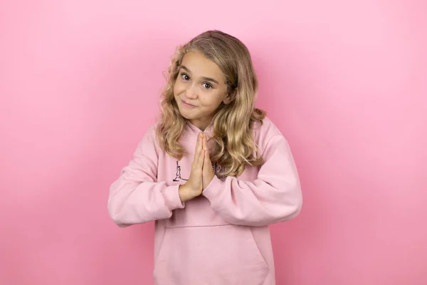 Young Beautiful Child Girl Standing Isolated Pink Background Begging Praying — Stock Photo, Image