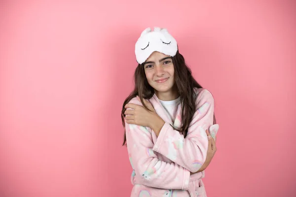 Pretty Girl Wearing Pajamas Sleep Mask Pink Background Hugging Oneself — Stock Photo, Image