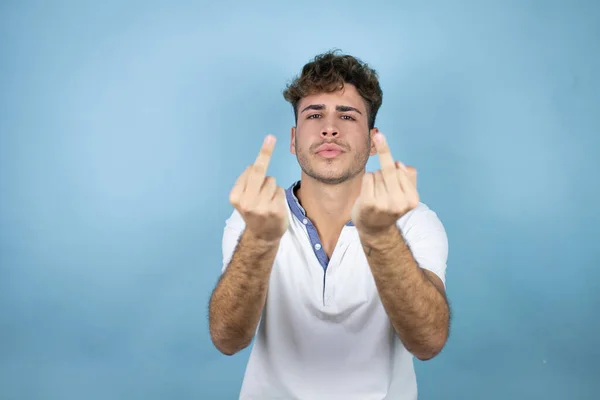 Young Handsome Man Wearing White Shirt Blue Background Showing Middle — ストック写真