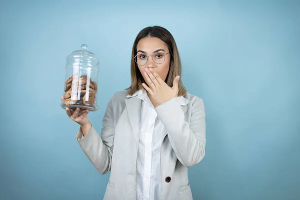 Young Beautiful Woman Holding Chocolate Chips Cookies Jar Isolated Blue — Stock Photo, Image