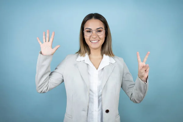 Young Business Woman Isolated Blue Background Showing Pointing Fingers Number — Stock Photo, Image