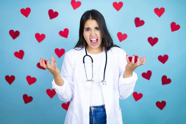 Young Doctor Woman Wearing Medical Coat Stethoscope Blue Background Red — Stock Photo, Image