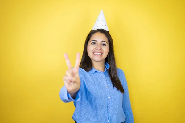 Young Caucasian Woman Wearing Birthday Hat Isolated Yellow Background Showing — Fotografia de Stock