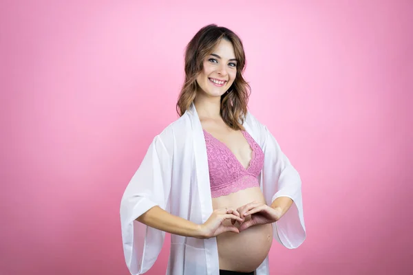 Young Beautiful Brunette Woman Pregnant Expecting Baby Isolated Pink Background — Stock Photo, Image