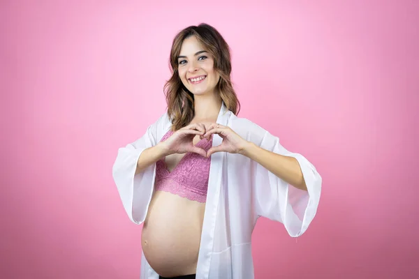 Young Beautiful Brunette Woman Pregnant Expecting Baby Isolated Pink Background — Stock Photo, Image