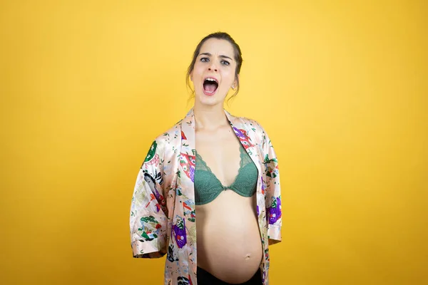 Young Beautiful Woman Pregnant Expecting Baby Wearing Pajama Isolated Yellow — Stock Photo, Image