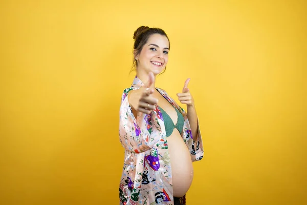 Young Beautiful Woman Pregnant Expecting Baby Wearing Pajama Isolated Yellow — Stock Photo, Image