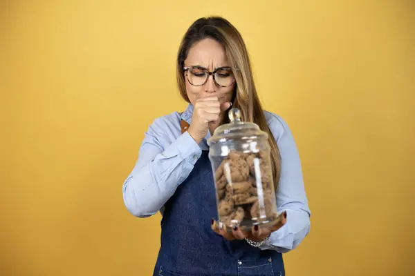 Young Hispanic Woman Wearing Baker Uniform Holding Cookies Jar Her — Stock Photo, Image