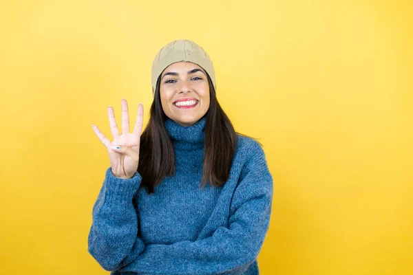 Young Beautiful Woman Wearing Blue Casual Sweater Wool Hat Showing — Stock Photo, Image