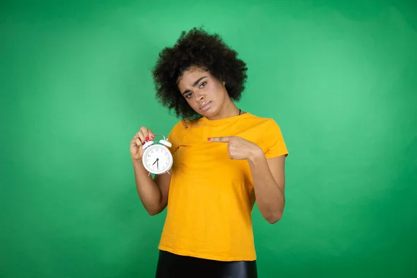 African American Woman Wearing Orange Casual Shirt Green Background Serious — Stock Photo, Image