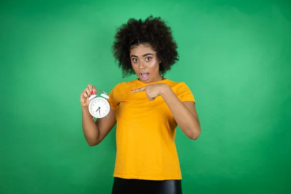 African American Woman Wearing Orange Casual Shirt Green Background Surprised — Stock Photo, Image