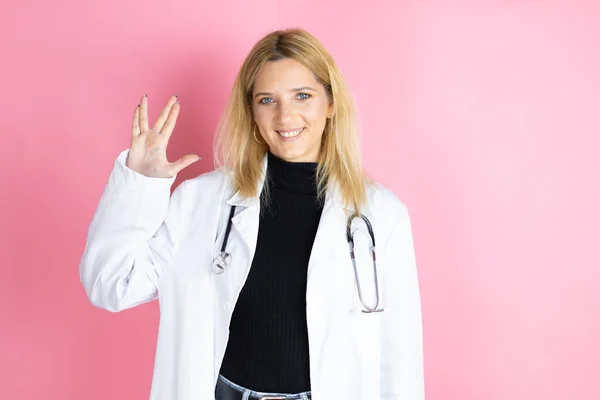 Young Blonde Doctor Woman Wearing Stethoscope Standing Isolated Pink Background — Stock Fotó