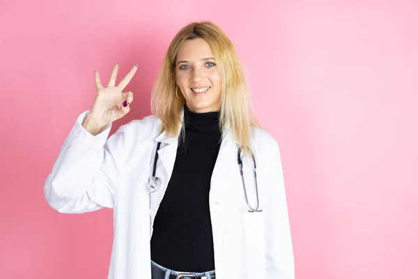 Young Blonde Doctor Woman Wearing Stethoscope Standing Isolated Pink Background — Stock Fotó