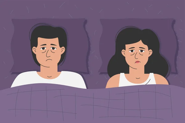 An unhappy man and a woman are lying in bed. The crisis of married life, problems between husband and wife.