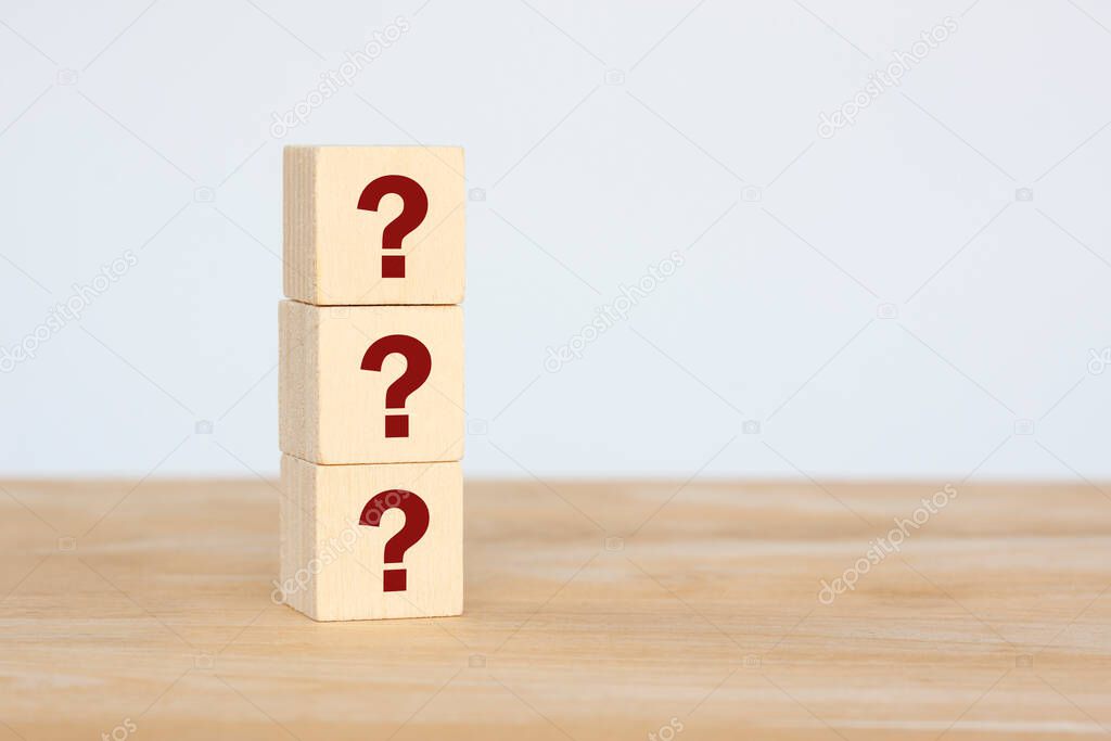 Row of wooden cube block shape with red question mark symbol for design concept, copy space for text on grey background.