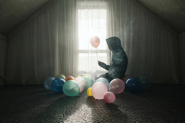 Young Man Wearing Hoodie Sitting Window Empty Room Balloons Smoke — Stock Photo, Image