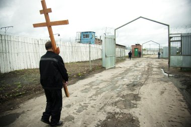 A prisoner brings orthodox cross clipart