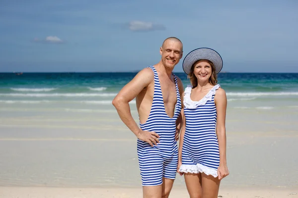 Couple in retro swimsuit on the beach — Stock Photo, Image