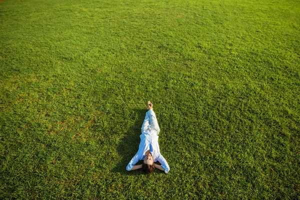 Woman relaxing on the grass