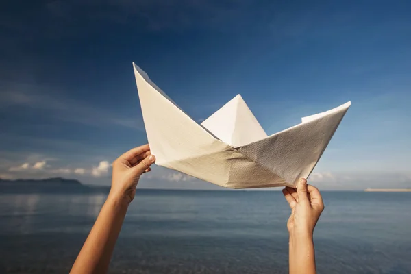 Paper boat in sea — Stock Photo, Image