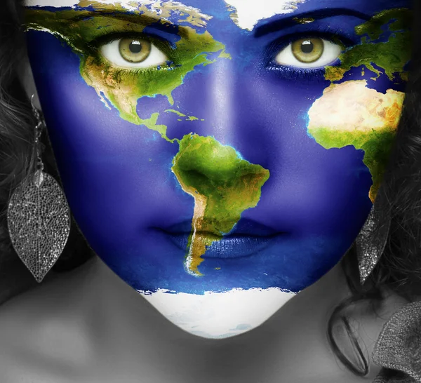 Map of the world on face of girl — Stock Photo, Image