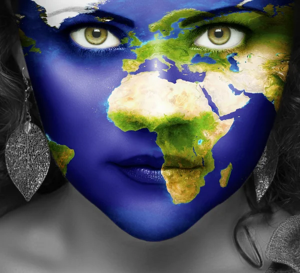 Map of the world on face of girl — Stock Photo, Image