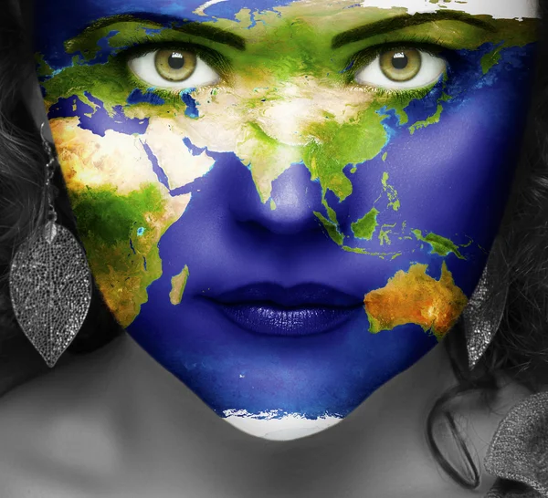 Map of the world on face of girl Stock Photo