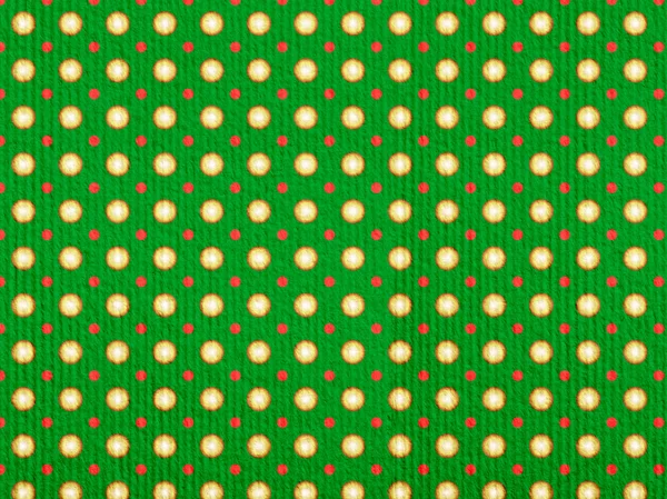 Різдвяний візерунок в жовтих і червоних точках на зеленому фоні — стокове фото