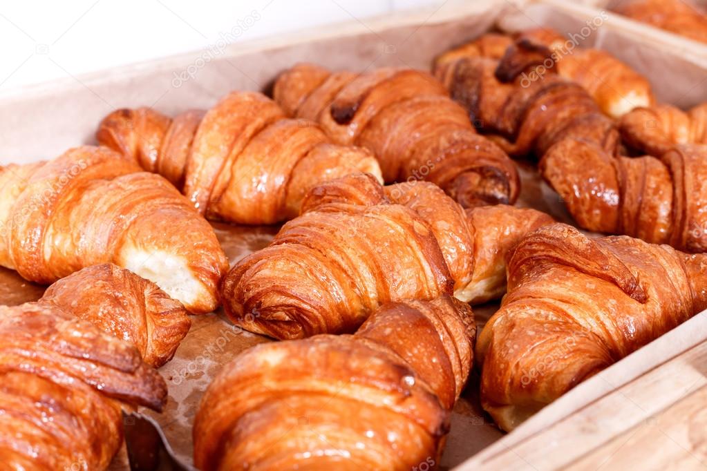 Sweet pastry, Croissants with chocolate and jam filling on shelf in