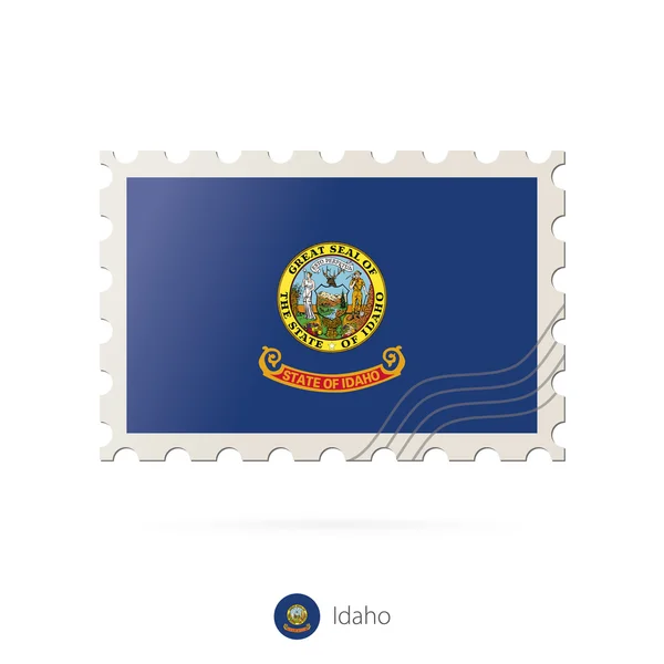 Sello postal con la imagen de la bandera del estado de Idaho . — Vector de stock