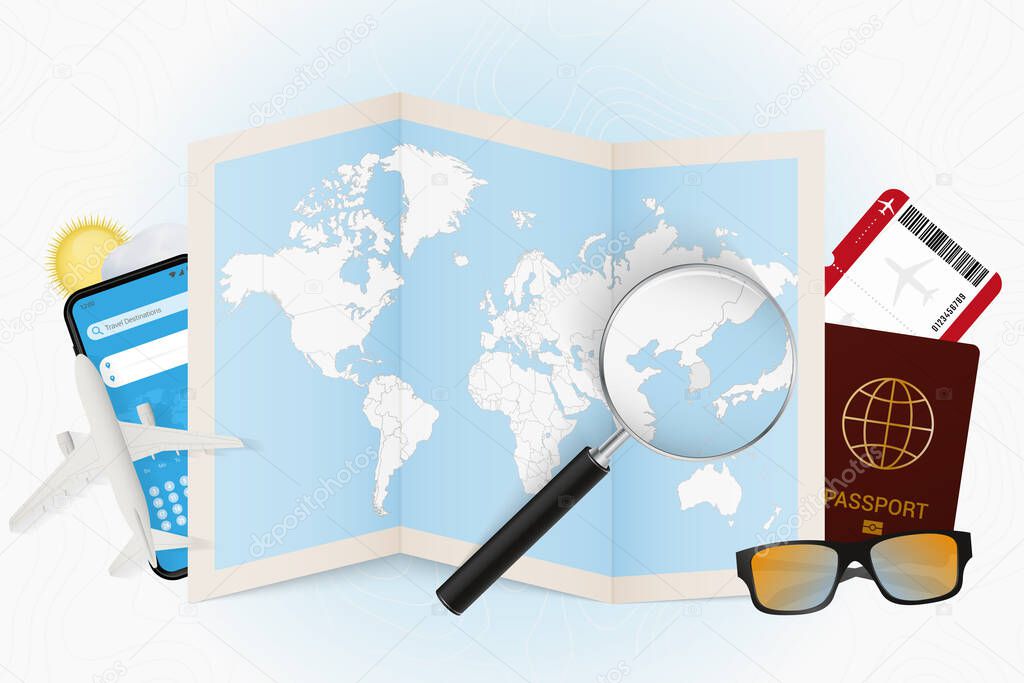 Travel destination South Korea, tourism mockup with travel equipment and world map with magnifying glass on a South Korea.