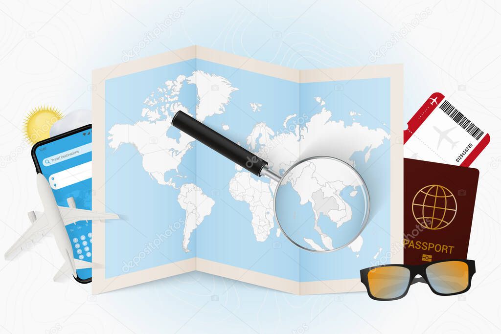 Travel destination Thailand, tourism mockup with travel equipment and world map with magnifying glass on a Thailand.