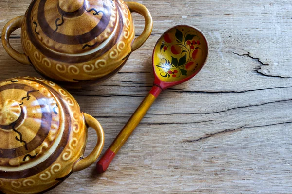 Ceramic pots, wooden spoon — Stock Photo, Image