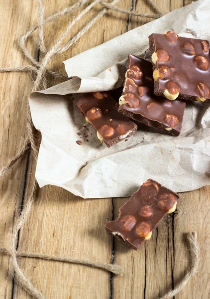 Chocolate nuts rope packing wooden sweet milk — Stock Photo, Image