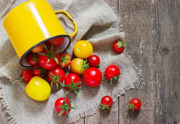 stock image colorful tomatoes in a metal mug