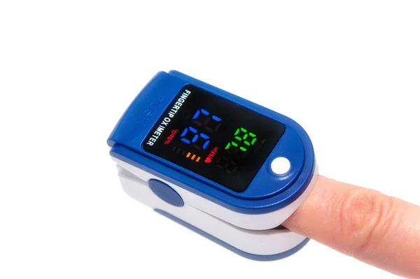 Pulse Oximeter Used Measure Pulse Rate Oxygen Levels Close Finger — Stock Photo, Image