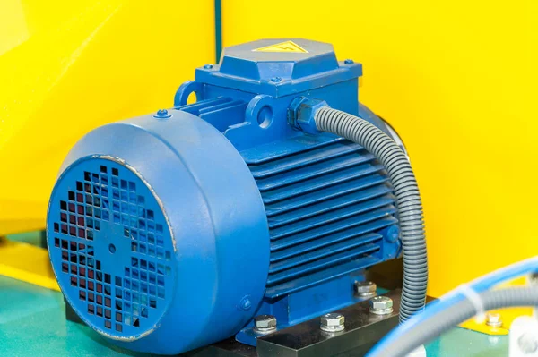Powerful electric motor with reducer. Electric motor on machine