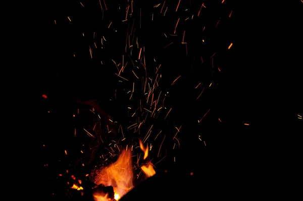 Red hot lines sparks on a black background — Stock Photo, Image