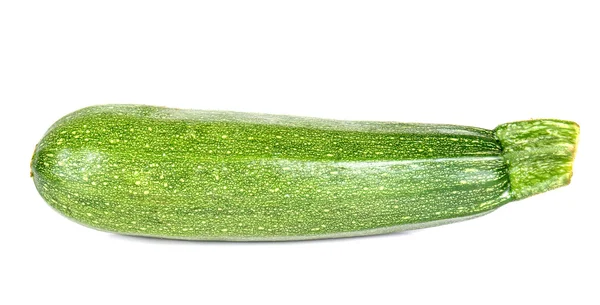 Courgette op witgepleisterde achtergrond. — Stockfoto