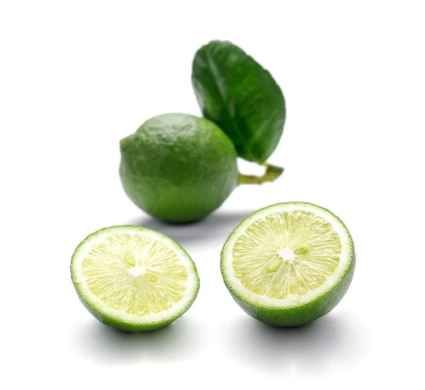 Green Lemons , Lemons cut pieces on white background. — Stock Photo, Image