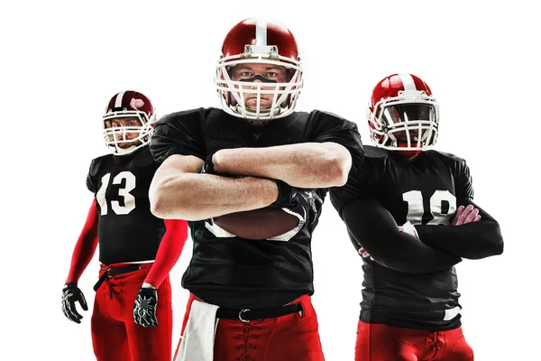 The three american football players posing with ball on white background — Stock Photo, Image