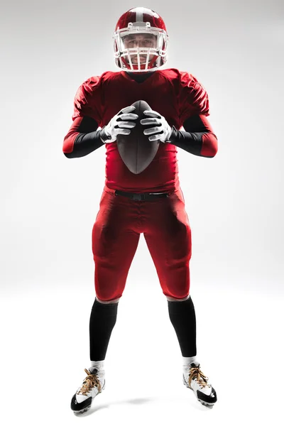 American football player posing with ball on white background — Stock Photo, Image