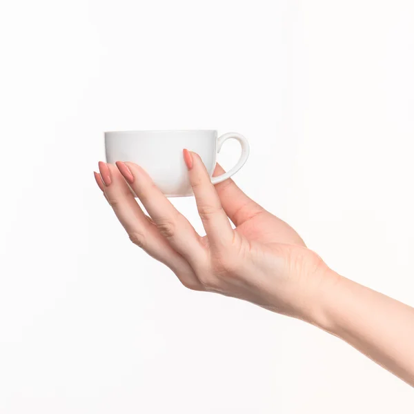 Mulher mão com copo no fundo branco — Fotografia de Stock