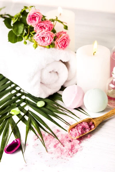 Spa setting with pink roses and aroma oil, vintage style — Stock Photo, Image