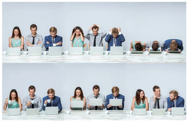 A equipe de negócios trabalhando em laptops no escritório — Fotografia de Stock