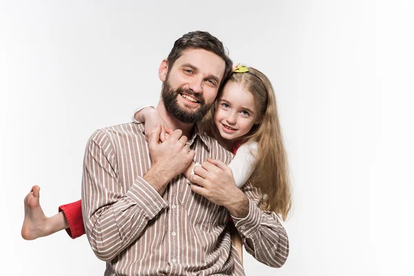 Girl hugging her father  over a white background — Stock Photo, Image