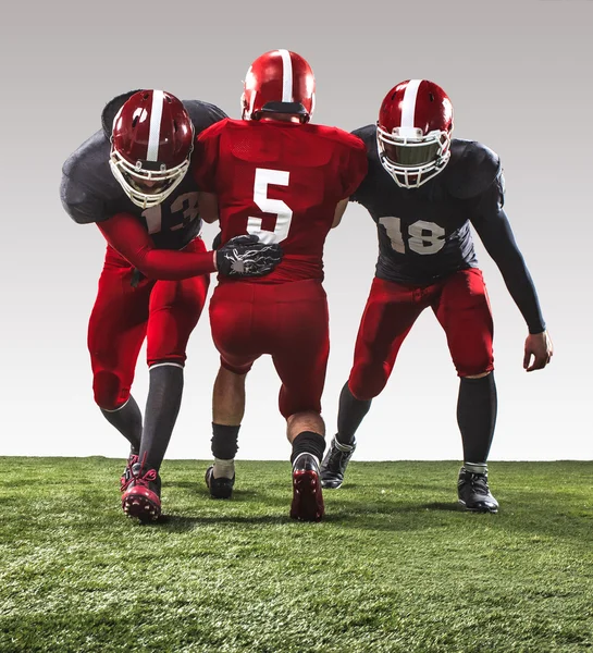 The three american football players in action — Stock Photo, Image