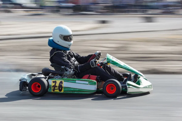 Karting - driver in helmet on kart circuit — Stock Photo, Image