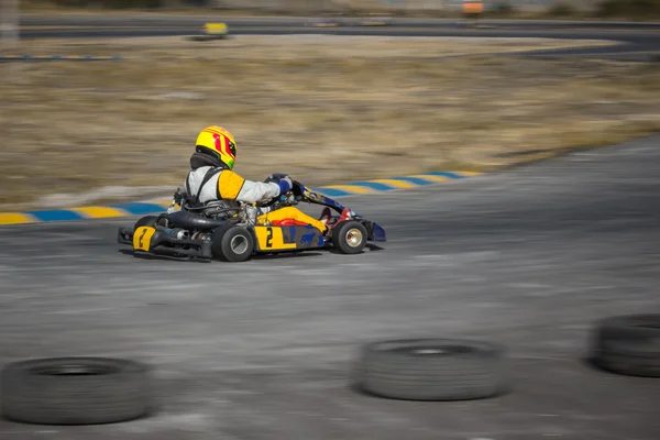 Karting - driver in helmet on kart circuit — Stock Photo, Image